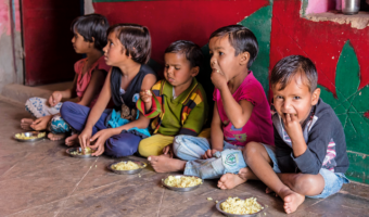 Young children eating fortified porridges